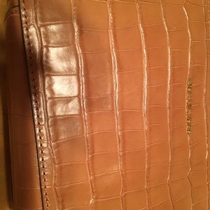 MK cross body bag. You can set the straps. Tan